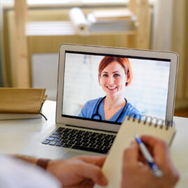 Immunisation Coalition Webinars a healthcare professional on screen with another taking notes